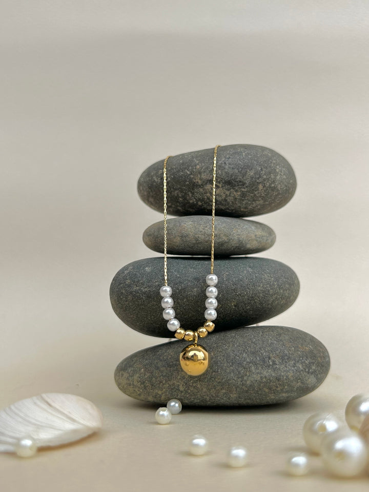 Golden ball pendant with pearl beads chain