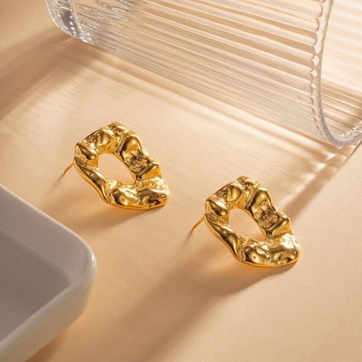 Irregular textured gold earrings